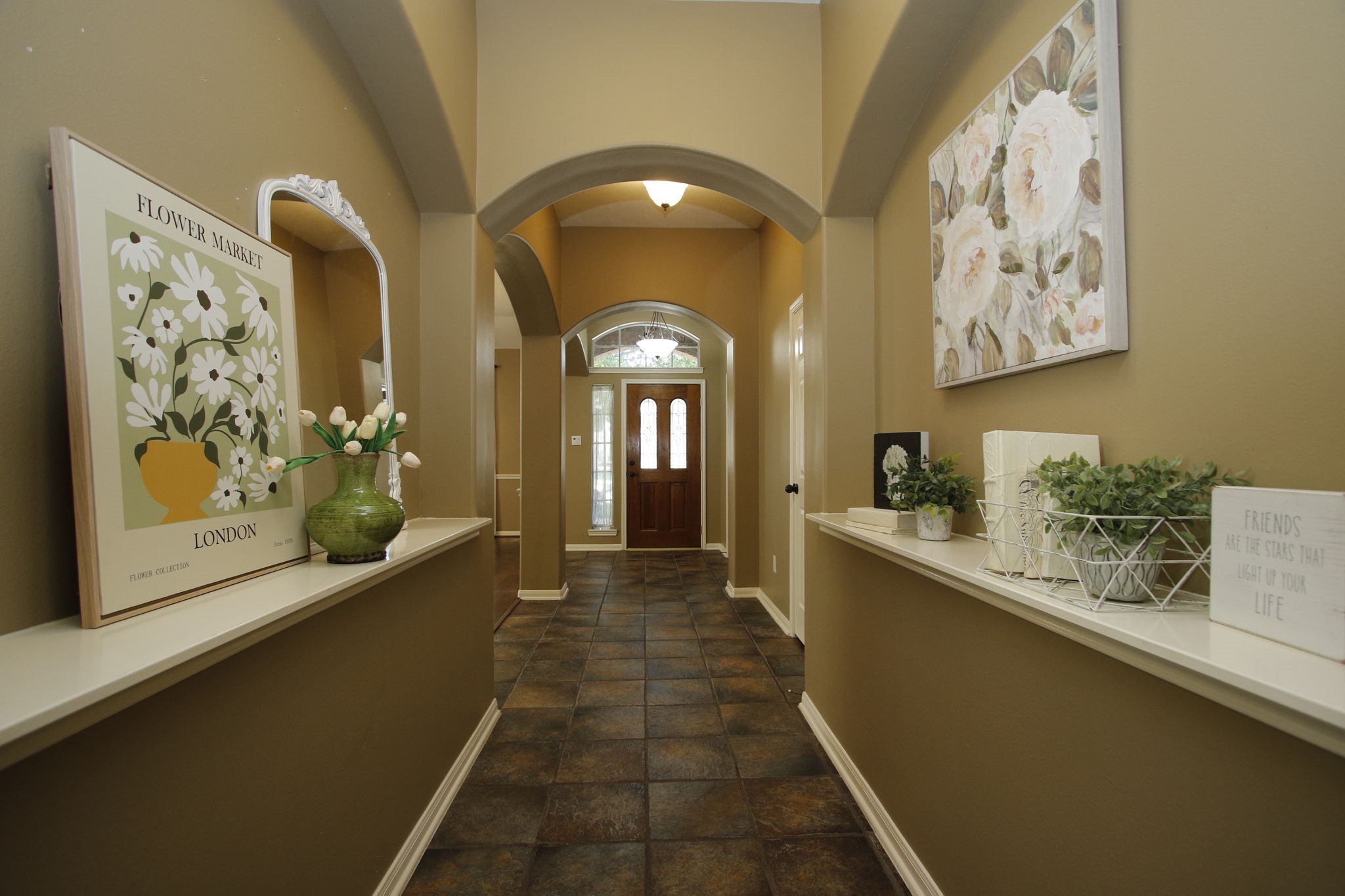 9203 Memorial Pines Way Spring, TX 77379 - Photo 10 of 45 This inviting long foyer features warm beige walls, decorative art niches, and this view is looking back at the front door.