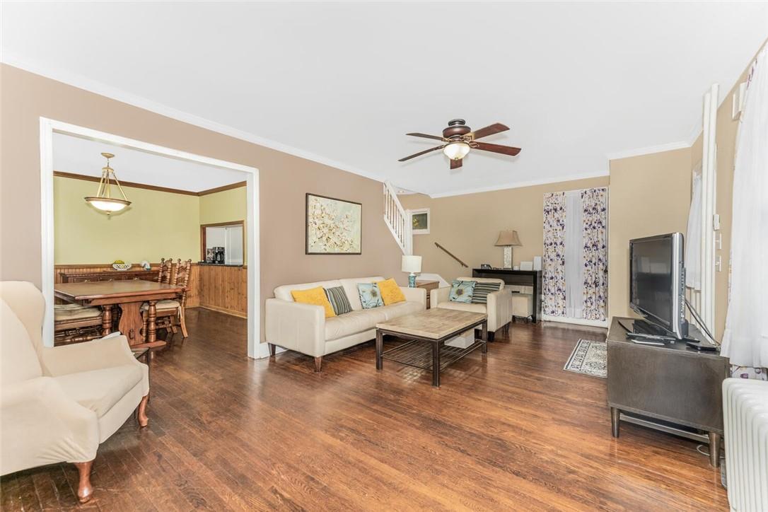 5650 Post Road Bronx, NY 10471 - Photo 14 of 34 a living room with furniture a fireplace and a flat screen tv