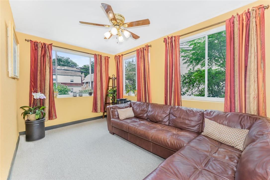 5650 Post Road Bronx, NY 10471 - Photo 15 of 34 a living room with furniture and a large window