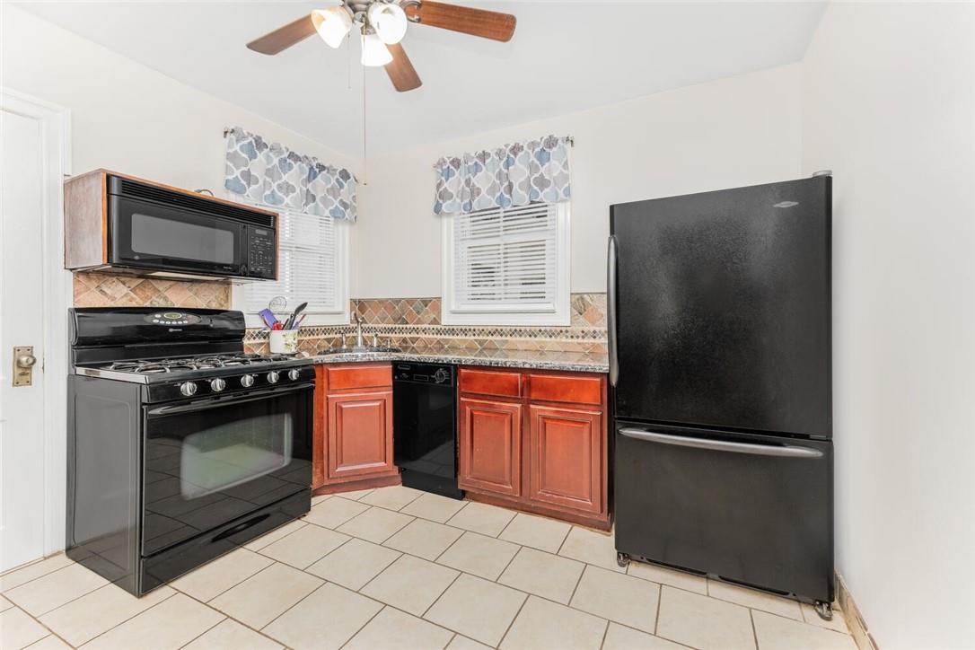 5650 Post Road Bronx, NY 10471 - Photo 5 of 34 a kitchen with stainless steel appliances granite countertop a refrigerator stove and microwave
