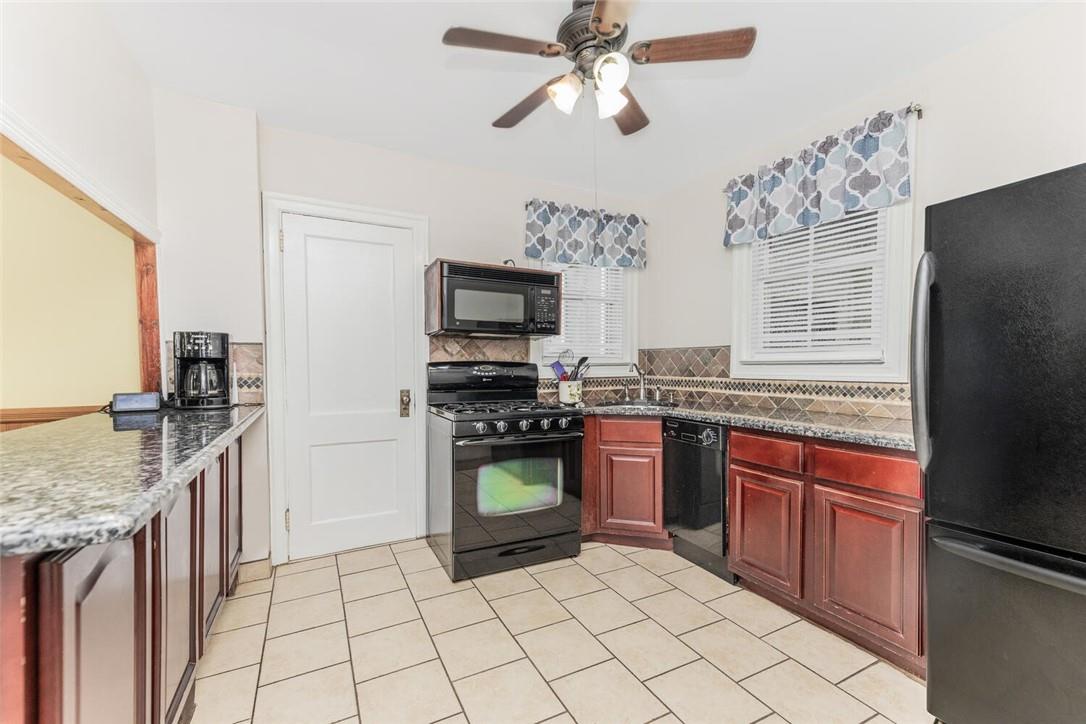 5650 Post Road Bronx, NY 10471 - Photo 6 of 34 a kitchen with stainless steel appliances granite countertop a sink stove and refrigerator