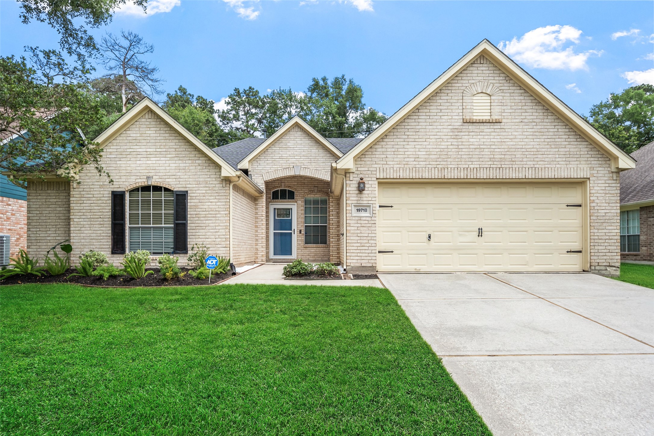 19718 Teller Boulevard Spring, TX 77388 - Photo 2 of 47 a front view of a house with a yard and garage