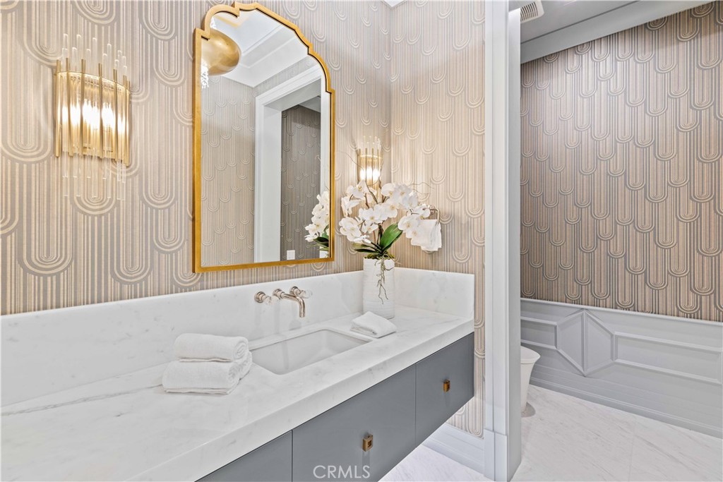 911 Hampton Road Arcadia, CA 91006 - Photo 15 of 73 a bathroom with a granite countertop sink and a mirror