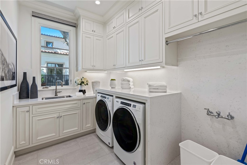 911 Hampton Road Arcadia, CA 91006 - Photo 19 of 73 a utility room with sink dryer and washer