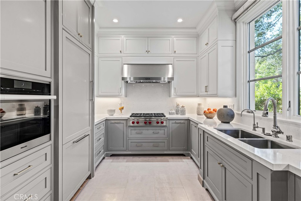 911 Hampton Road Arcadia, CA 91006 - Photo 30 of 73 a kitchen with stainless steel appliances granite countertop a sink and cabinets
