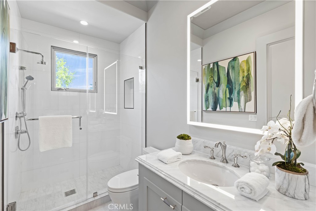 911 Hampton Road Arcadia, CA 91006 - Photo 40 of 73 a bathroom with a granite countertop sink a toilet and shower