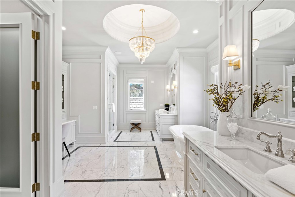 911 Hampton Road Arcadia, CA 91006 - Photo 48 of 73 a en suite bathroom with a granite countertop sink and a mirror