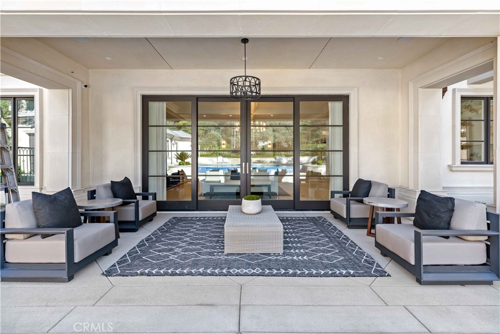 911 Hampton Road Arcadia, CA 91006 - Photo 57 of 73 a living room with furniture and a chandelier