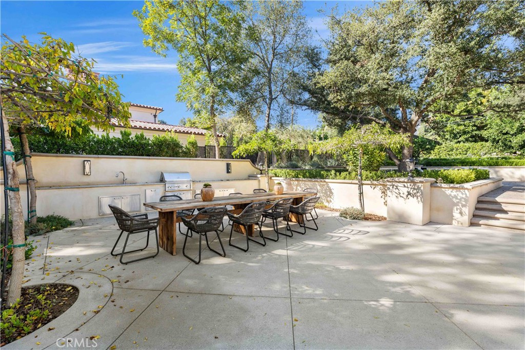 911 Hampton Road Arcadia, CA 91006 - Photo 58 of 73 a view of a patio with table and chairs and potted plants