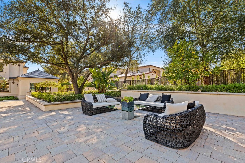 911 Hampton Road Arcadia, CA 91006 - Photo 63 of 73 a backyard of a house with fountain table and chairs