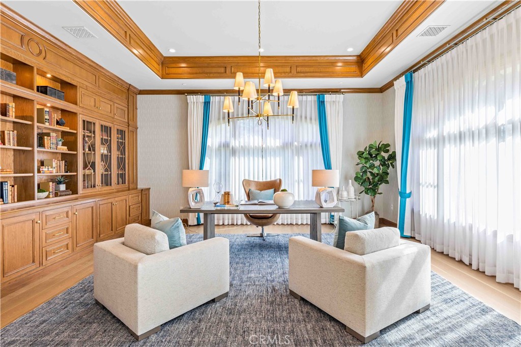 911 Hampton Road Arcadia, CA 91006 - Photo 10 of 73 a living room with furniture and a chandelier