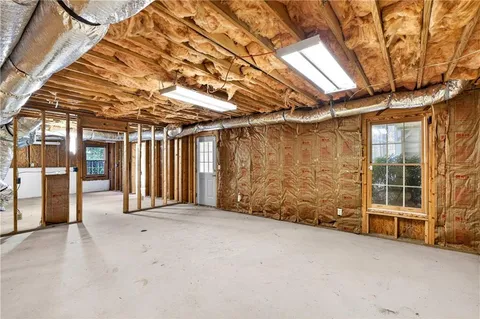 a view of empty room with wooden walls