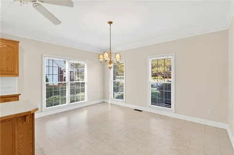 a view of an empty room with windows