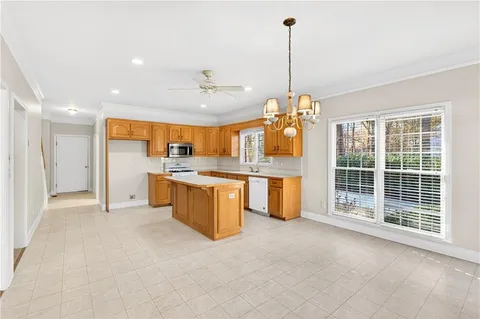 a view of a kitchen with furniture and a chandelier