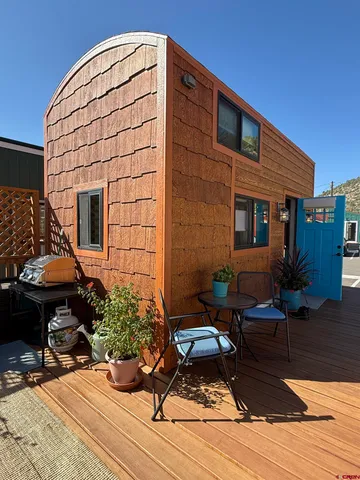 a backyard of a house with seating space