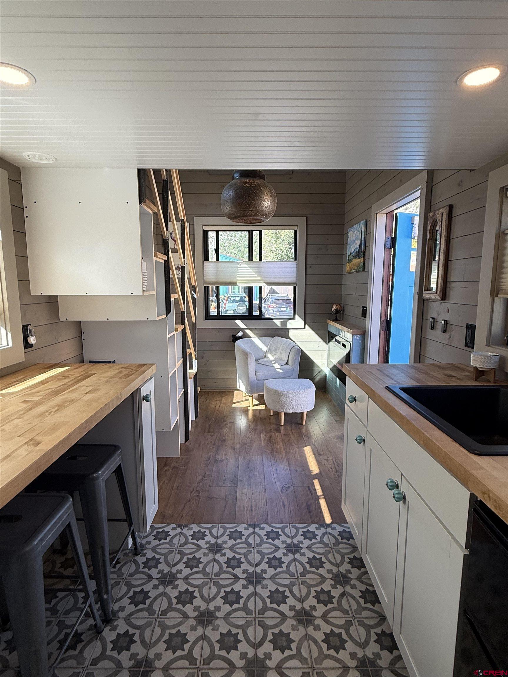 90 Animas View Drive, Unit 5 Durango, CO 81301 - Photo 11 of 30 a living room with stainless steel appliances granite countertop furniture rug and wooden floor