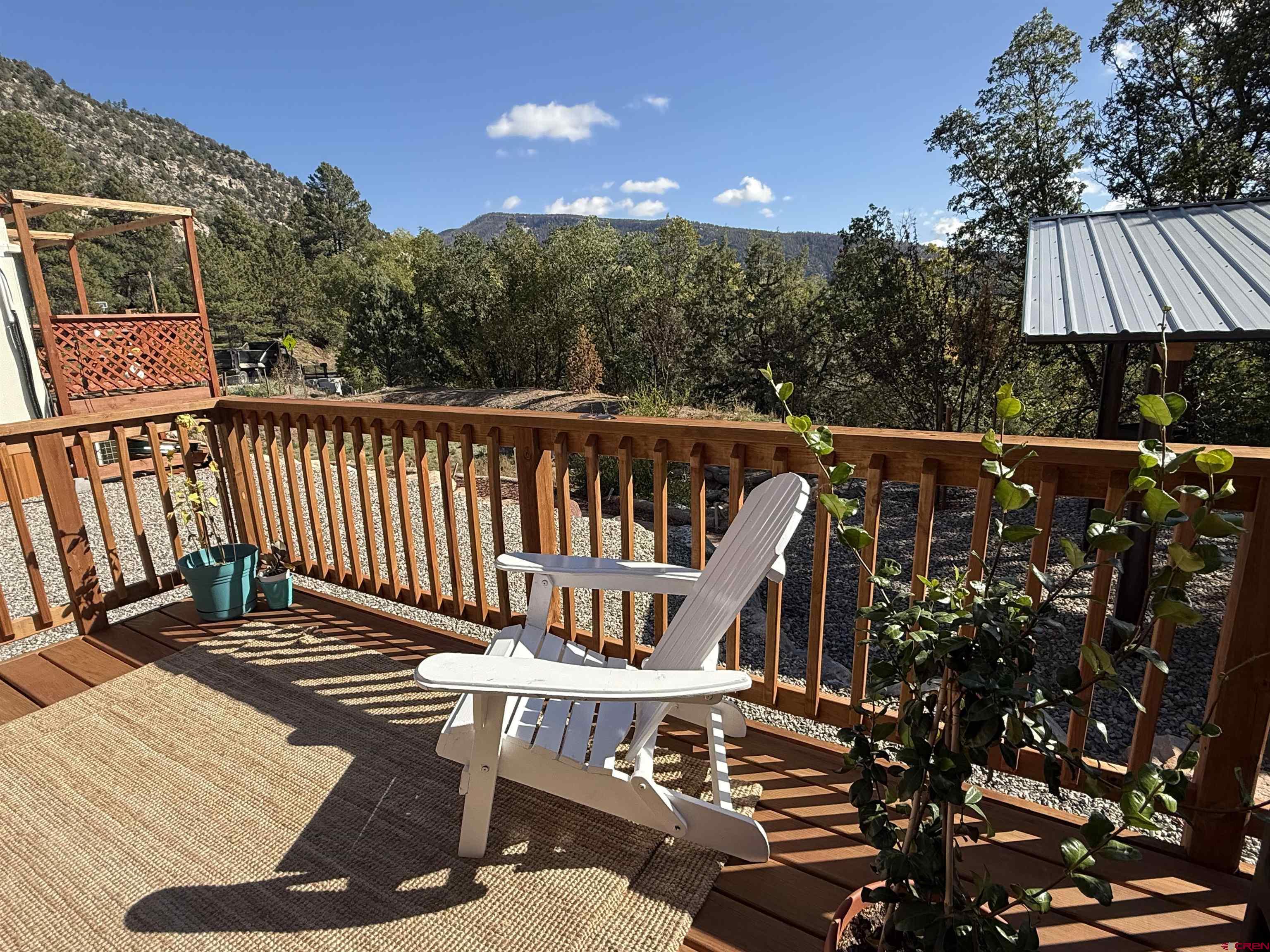 90 Animas View Drive, Unit 5 Durango, CO 81301 - Photo 21 of 30 a view of a roof deck with wooden floor and fence