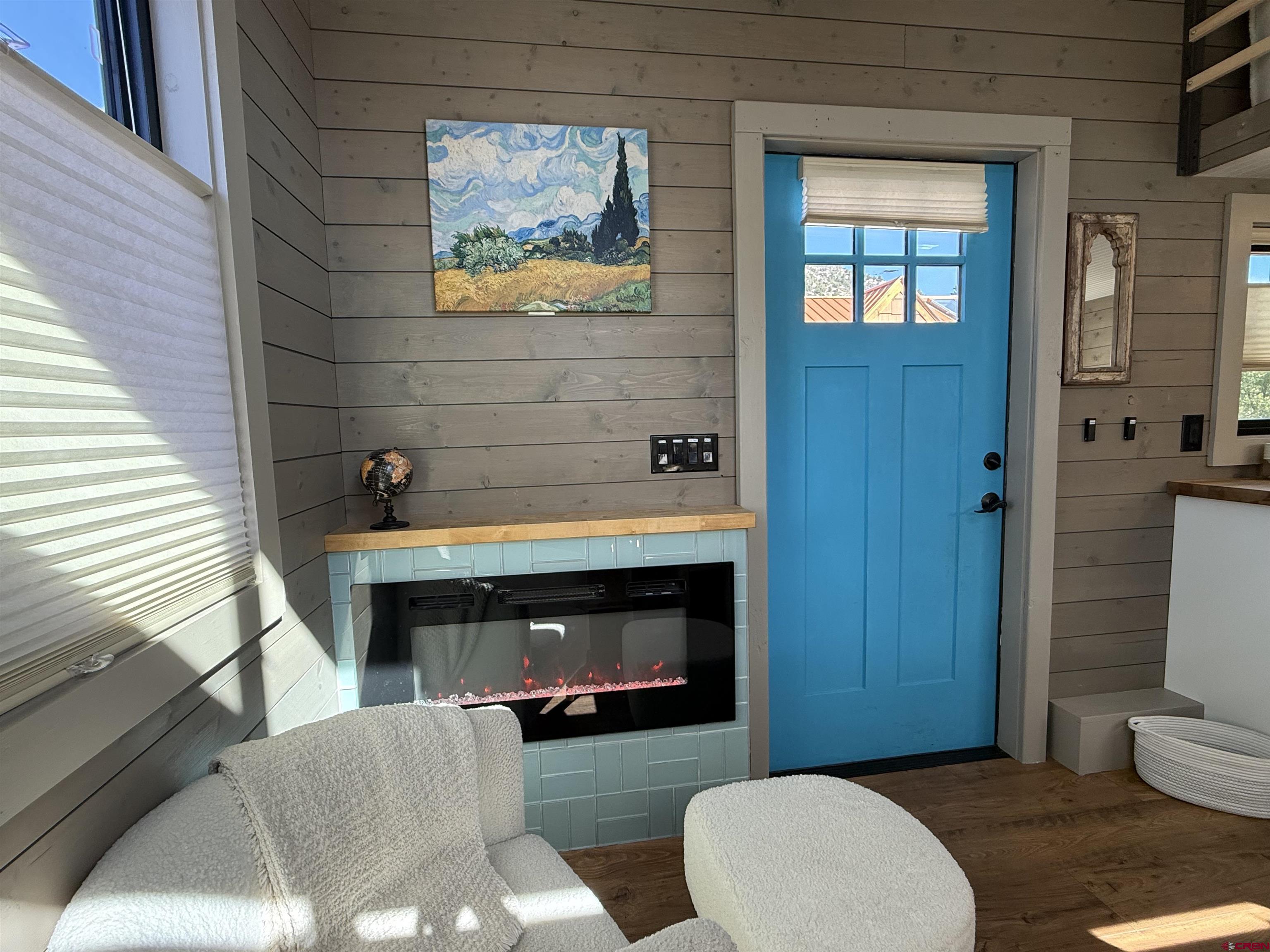 90 Animas View Drive, Unit 5 Durango, CO 81301 - Photo 29 of 30 a living room with furniture and a fireplace
