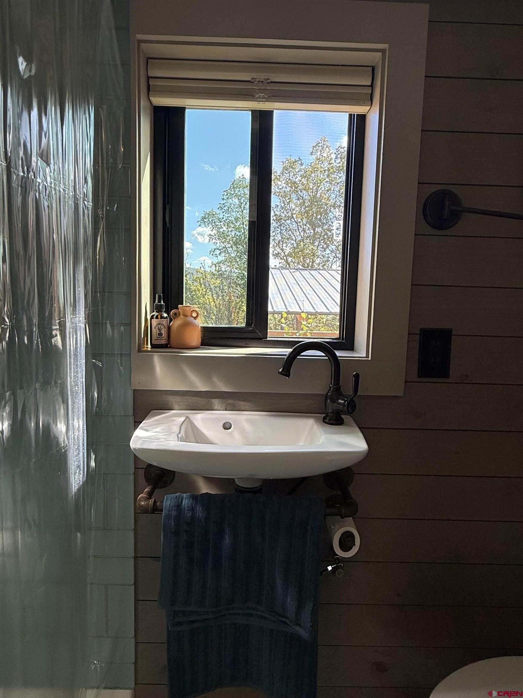 90 Animas View Drive, Unit 5 Durango, CO 81301 - Photo 30 of 30 a bathroom with a sink and a mirror