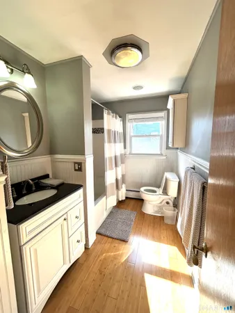 a living room with a sink furniture and a kitchen view