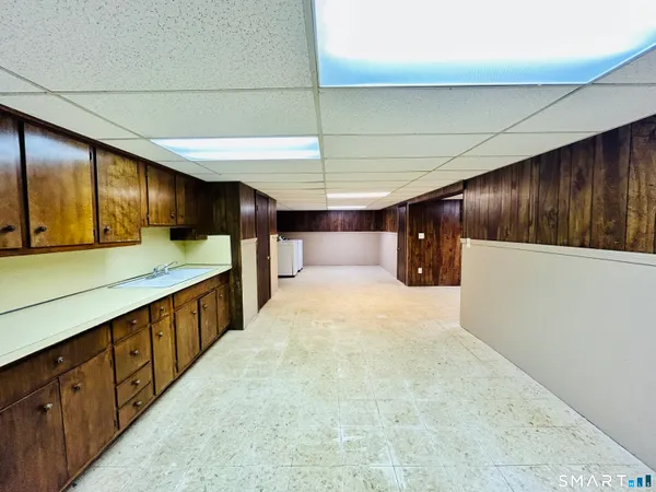 a large room with lots of wooden cabinets