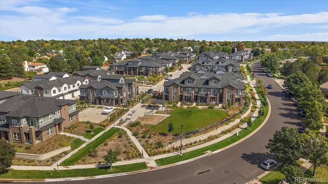 a view of a swimming pool with lawn chairs