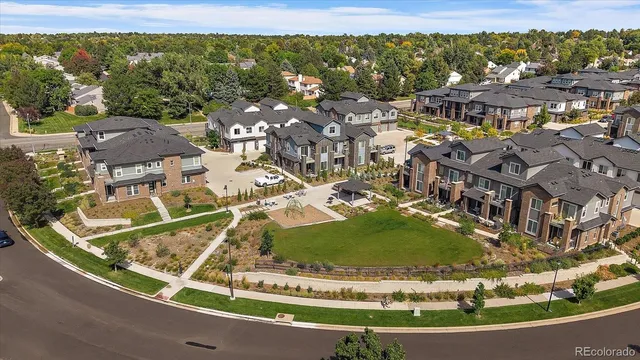 a view of a swimming pool with outdoor seating and plants