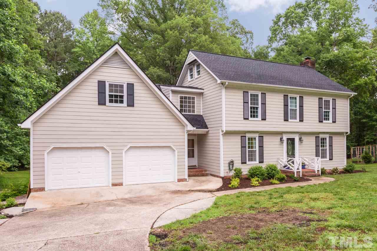 412 Amelia Avenue Raleigh, NC 27615 - Photo 2 of 25 a front view of a house with garden