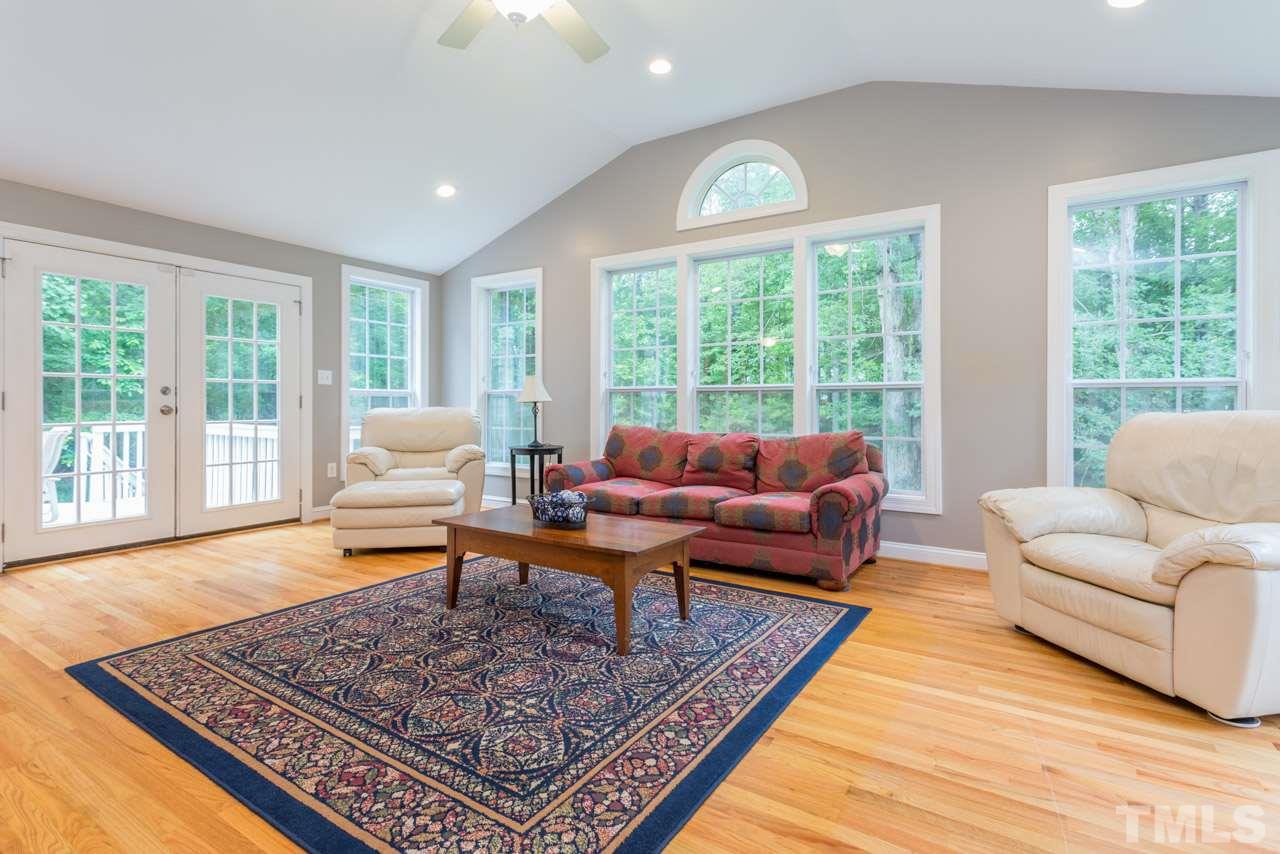 412 Amelia Avenue Raleigh, NC 27615 - Photo 11 of 25 a living room with furniture and a rug