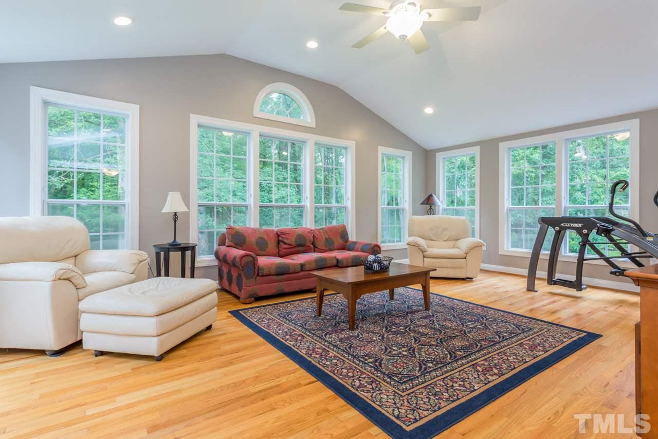 412 Amelia Avenue Raleigh, NC 27615 - Photo 12 of 25 a living room with furniture and a large window