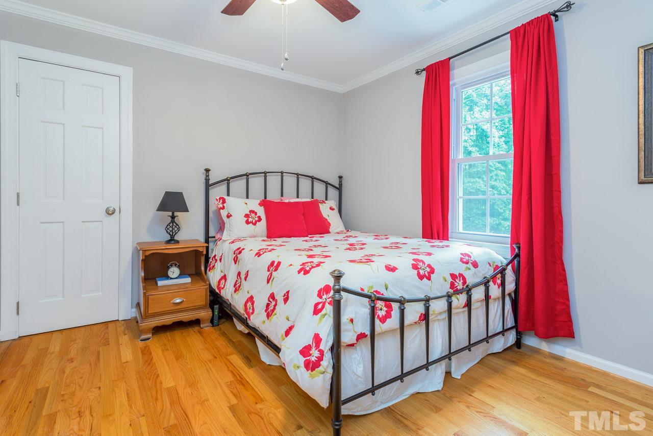 412 Amelia Avenue Raleigh, NC 27615 - Photo 18 of 25 a bedroom with a bed and a window