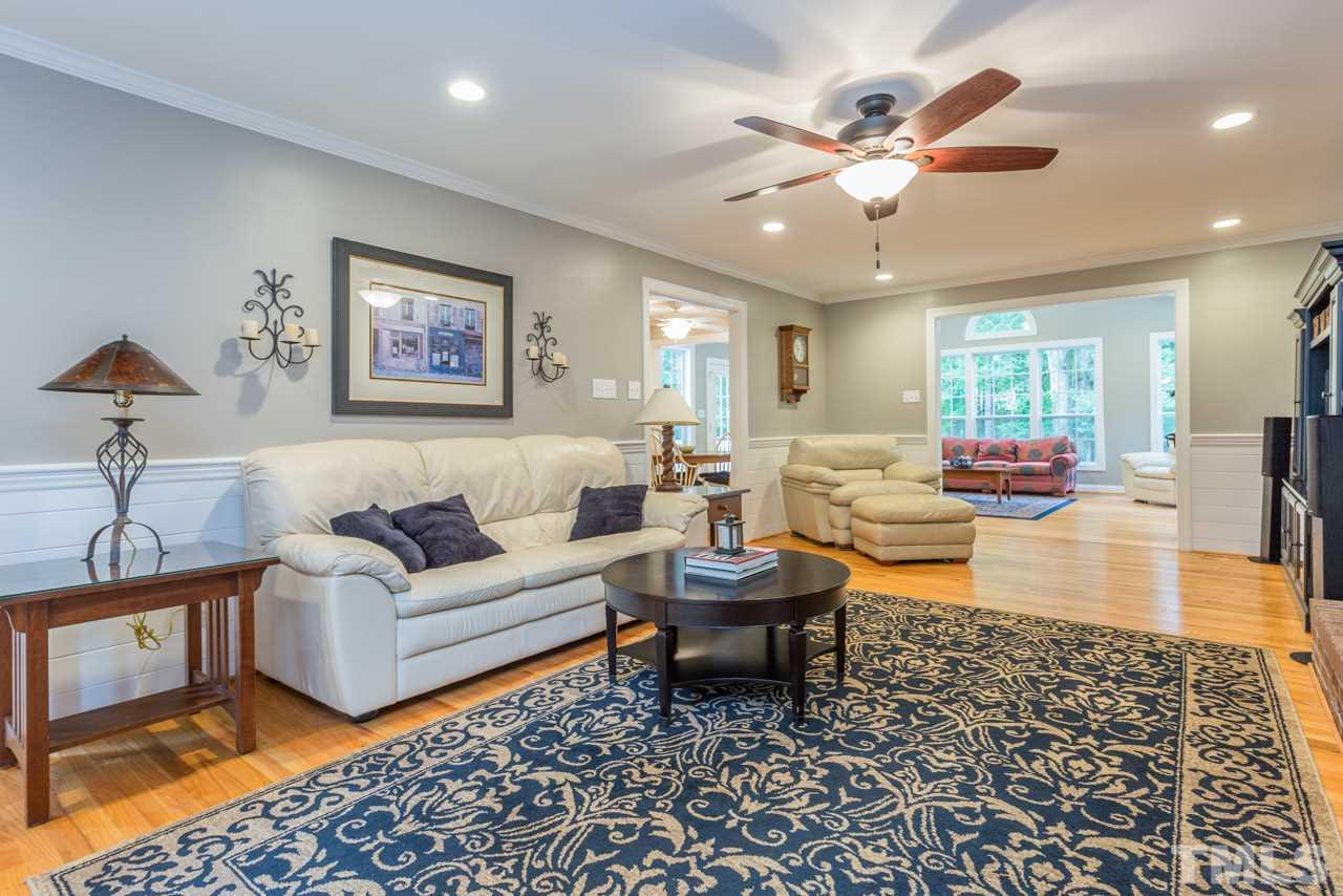 412 Amelia Avenue Raleigh, NC 27615 - Photo 3 of 25 a living room with furniture and a rug