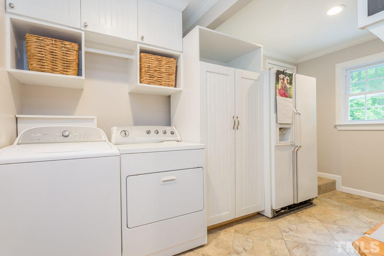 412 Amelia Avenue Raleigh, NC 27615 - Photo 21 of 25 a utility room with dryer and washer