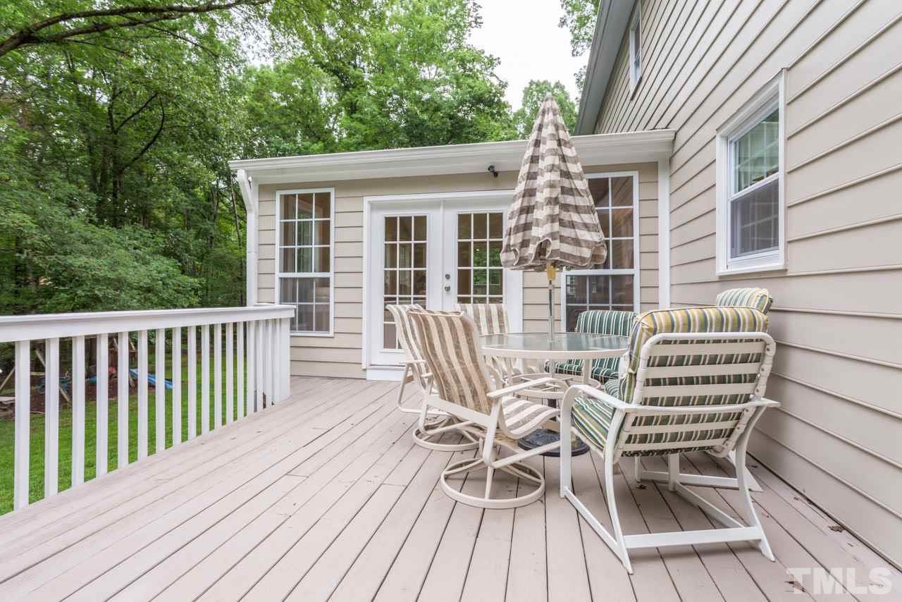 412 Amelia Avenue Raleigh, NC 27615 - Photo 24 of 25 a view of a chair and table on the deck