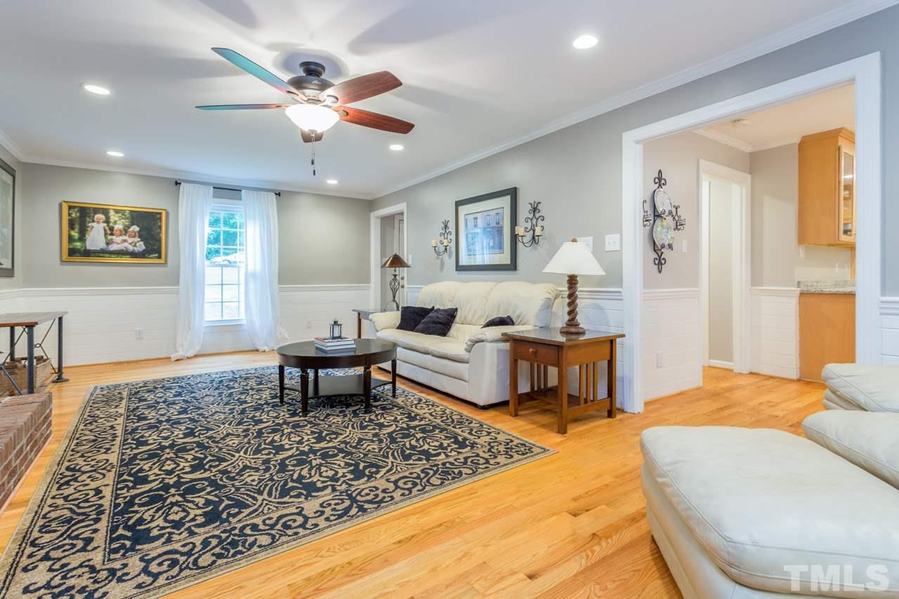 412 Amelia Avenue Raleigh, NC 27615 - Photo 5 of 25 a living room with furniture and a rug