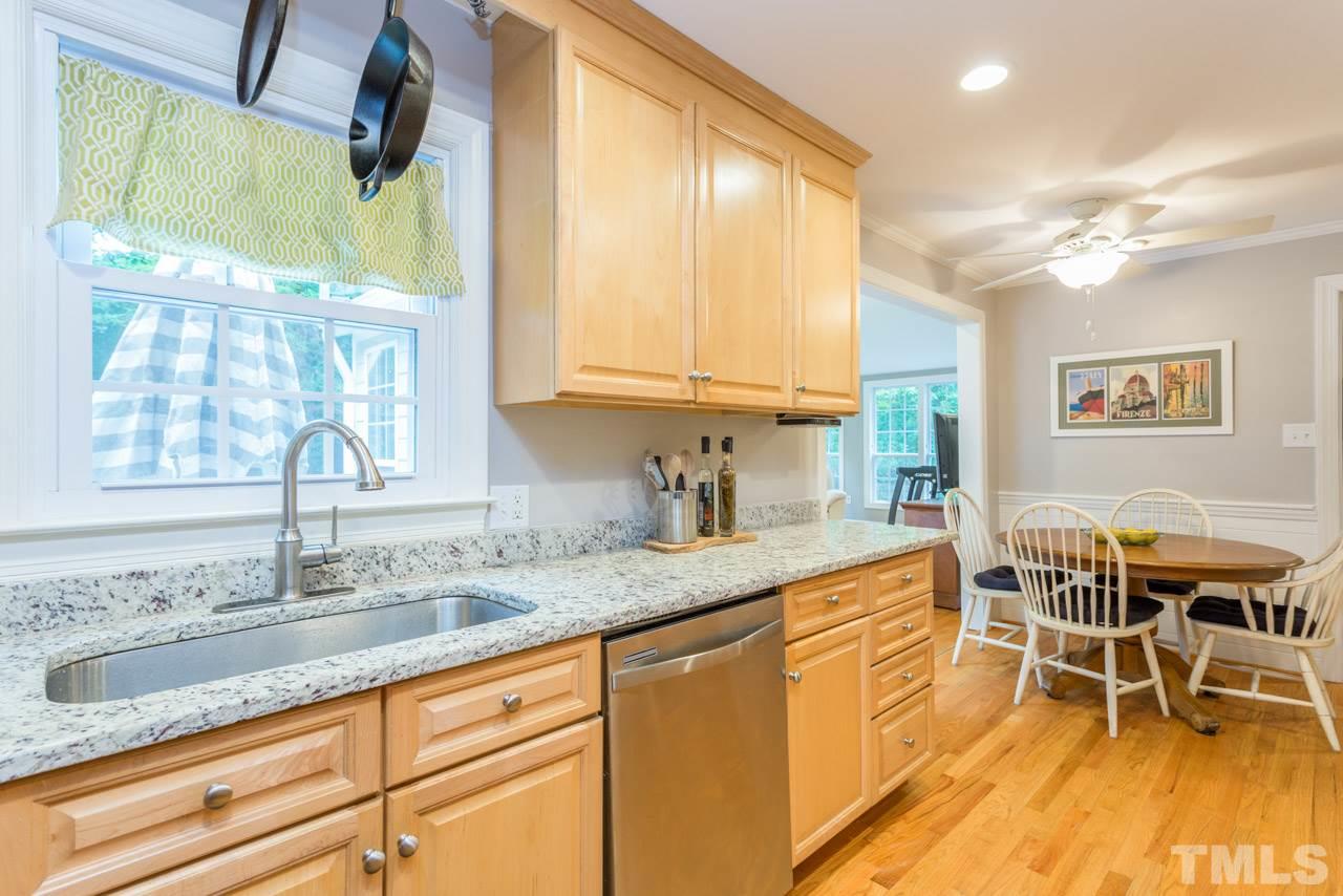 412 Amelia Avenue Raleigh, NC 27615 - Photo 9 of 25 a kitchen with a sink and cabinets