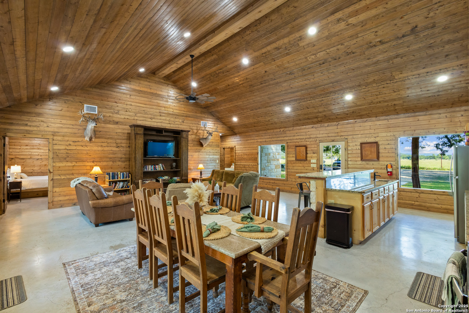 370 Johnny Seibert Rio Frio, TX 78873 - Photo 14 of 40 a very nice looking open dining room with furniture window and wooden floor