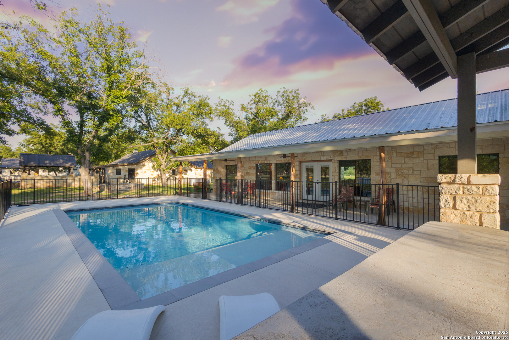 370 Johnny Seibert Rio Frio, TX 78873 - Photo 30 of 40 a swimming pool with outdoor seating and yard