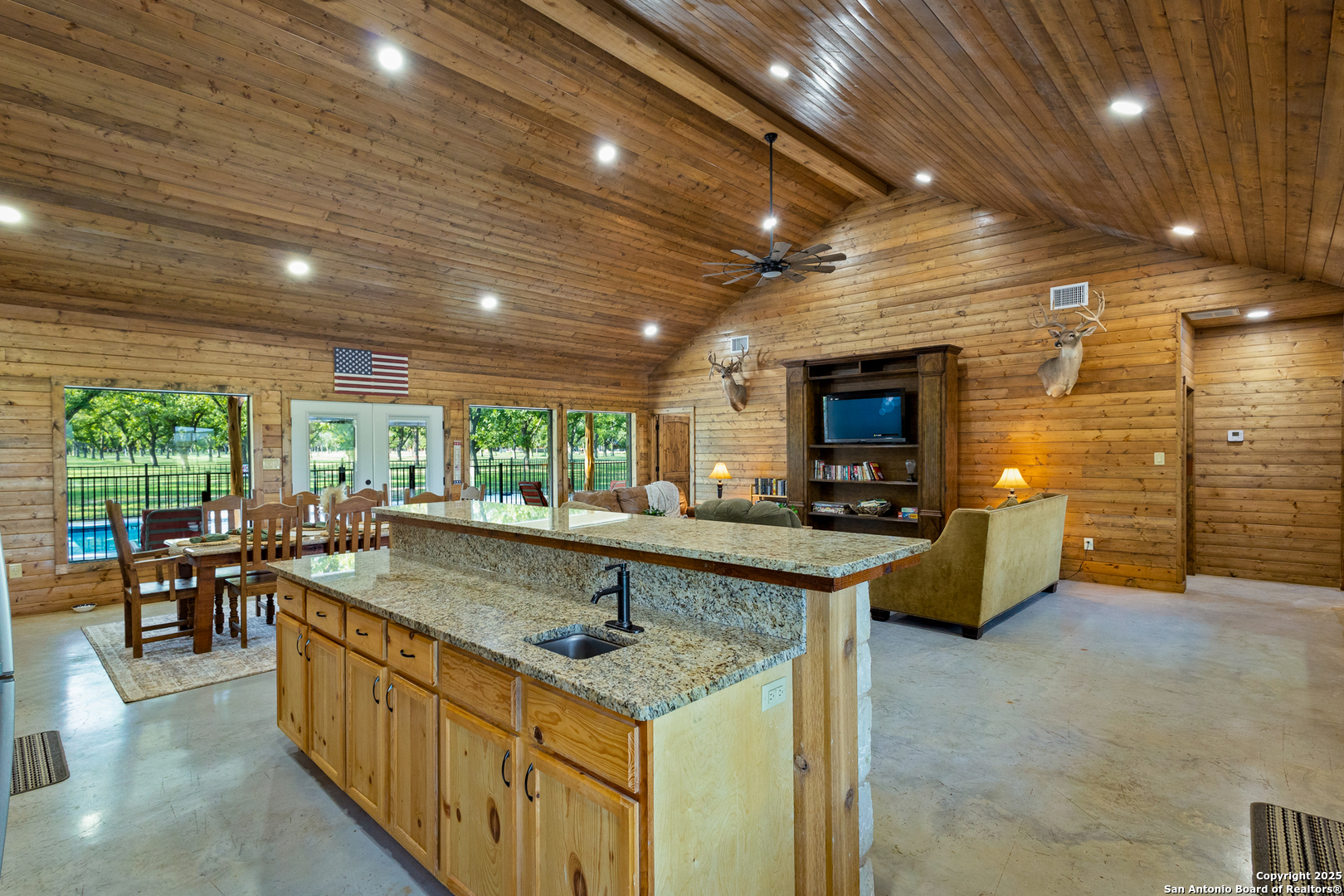 370 Johnny Seibert Rio Frio, TX 78873 - Photo 7 of 40 a large kitchen with kitchen island a large window in it