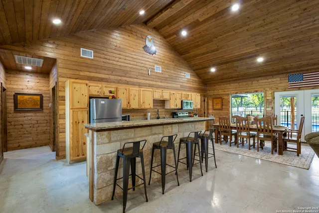 a group of chairs sitting in kitchen and dining room