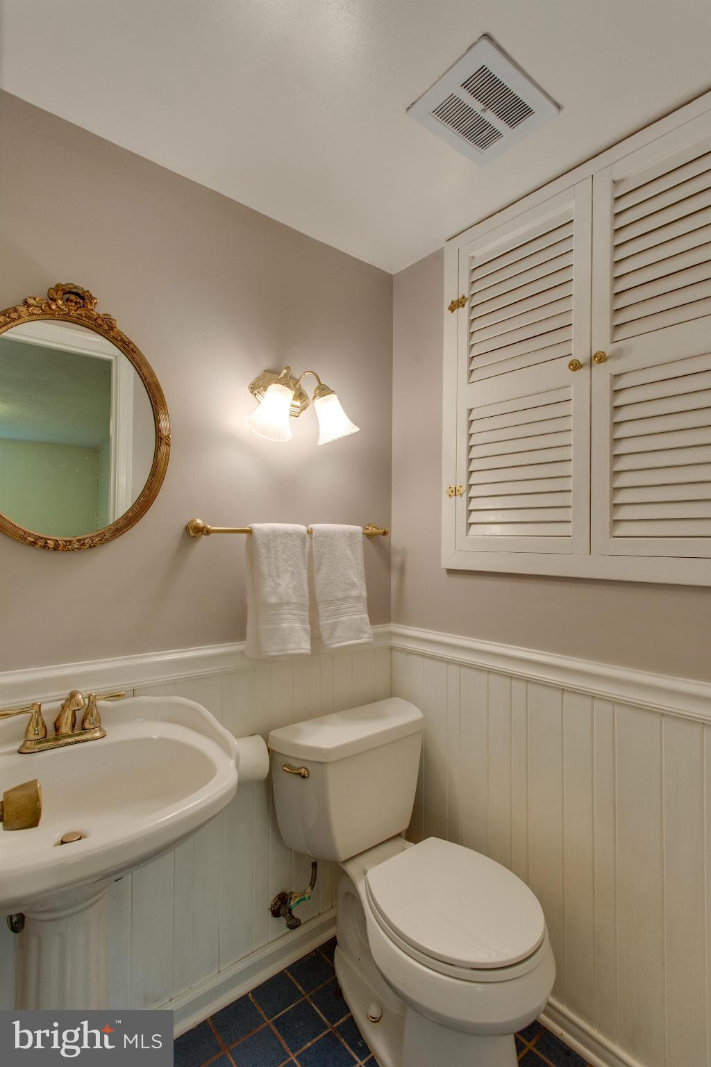 8735 Fort Hunt Road Alexandria, VA 22308 - Photo 23 of 30 Half bath with beadboard detail