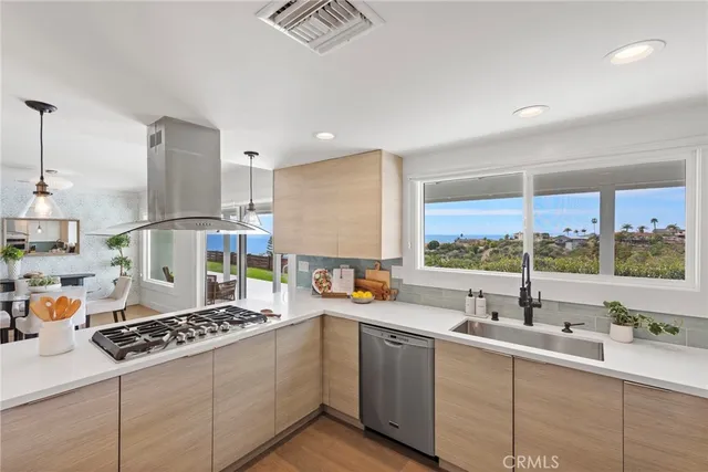 a kitchen with a window a sink and a counter top space