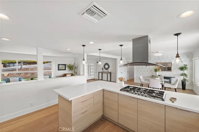 a view of a livingroom with furniture and wooden floor