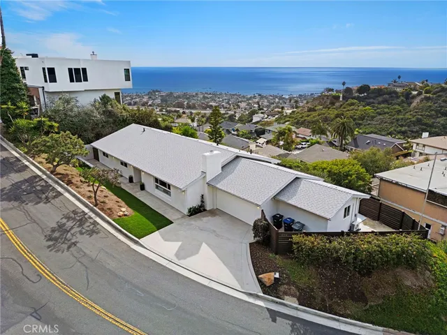 an aerial view of house with yard swimming pool and outdoor seating