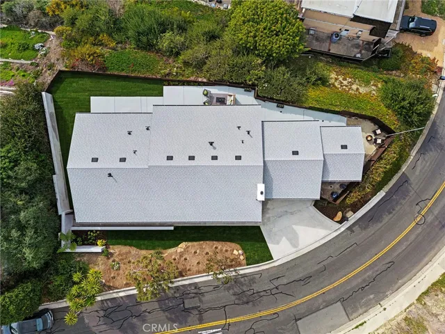 an aerial view of a house with a garden