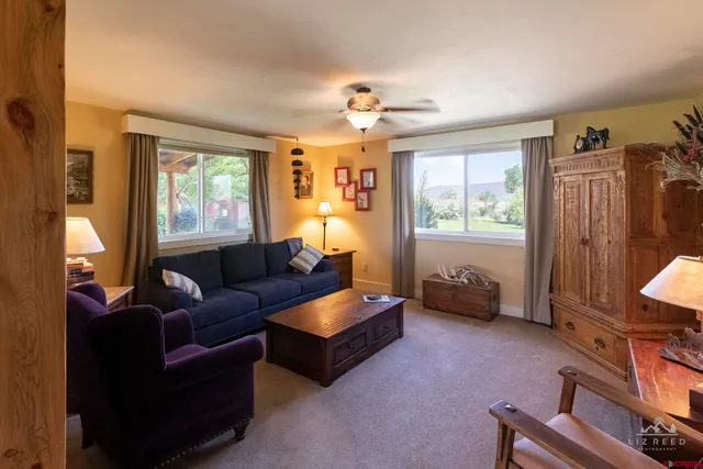 a living room with furniture and a window