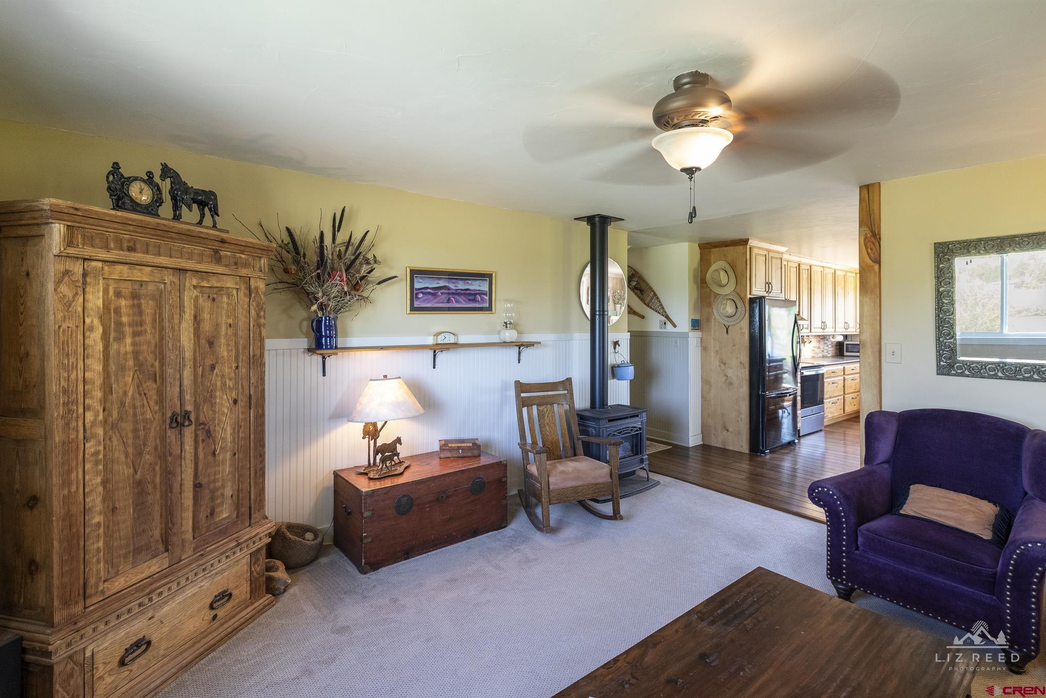 11450 Crawford Road Paonia, CO 81428 - Photo 13 of 41 a living room with furniture and a chandelier