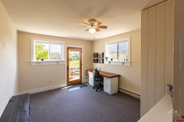 a view of a room with window and cabinet