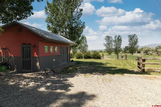 a view of a street with a building in the background