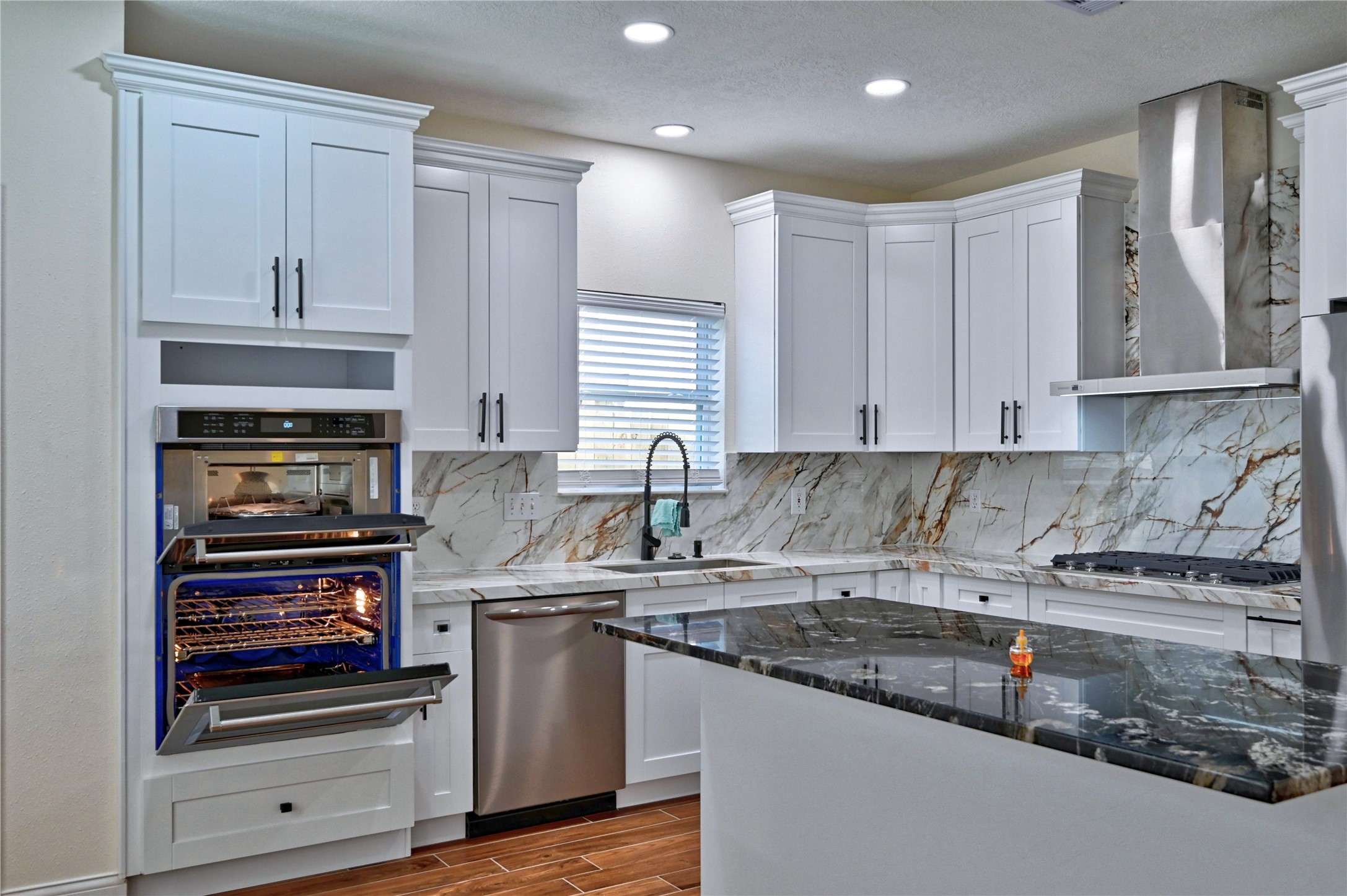 17907 Pelican Way Road Houston, TX 77084 - Photo 11 of 38 a kitchen with stainless steel appliances granite countertop a sink stove and cabinets